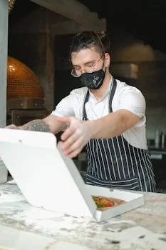 pizza chef working at coal oven